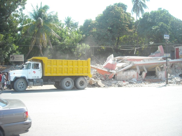 DumpTruck A dump truck beside a collapsed building in Port-au-Prince Haiti