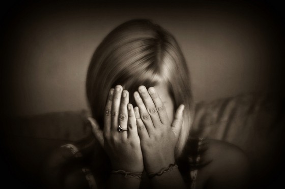 sad girl head in hands