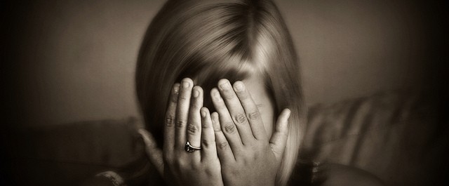 sad girl head in hands
